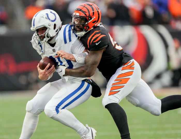 Dec 10, 2023; Cincinnati, Ohio, USA; Cincinnati Bengals linebacker Germaine Pratt (57) works to bring down Indianapolis Colts quarterback Gardner Minshew II (10) at Paycor Stadium. Mandatory Credit: Bob Scheer-USA TODAY Sports